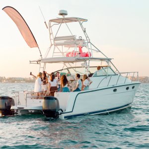 A group of people are enjoying a party on a charter boat